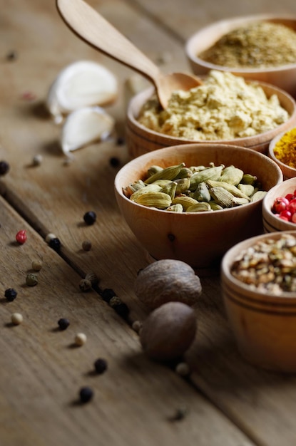 close up of spices and herbs in bowls